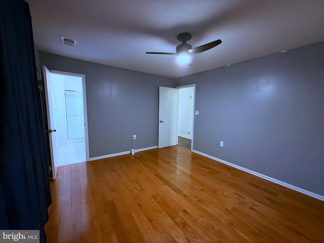 unfurnished bedroom featuring light hardwood / wood-style floors and ceiling fan