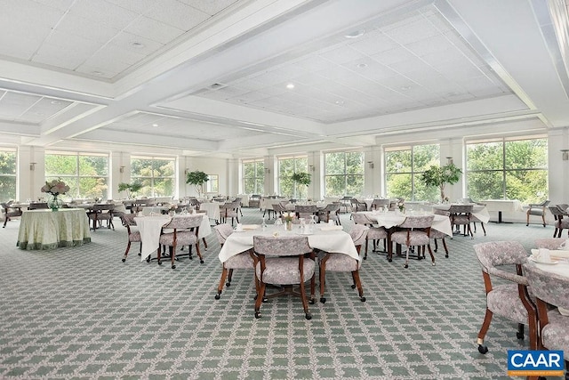 sunroom featuring beamed ceiling, plenty of natural light, and coffered ceiling