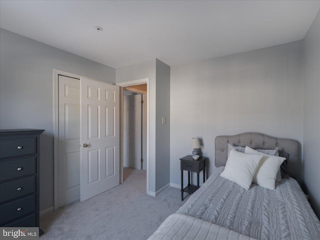 bedroom with light colored carpet