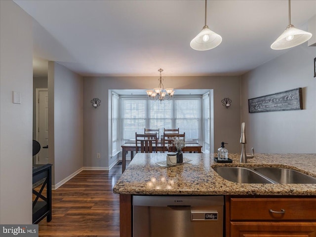 kitchen featuring sink, decorative light fixtures, and dishwasher