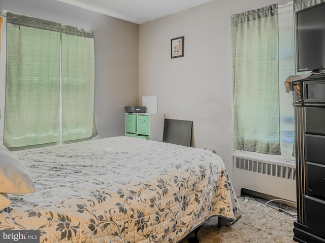 bedroom featuring radiator heating unit