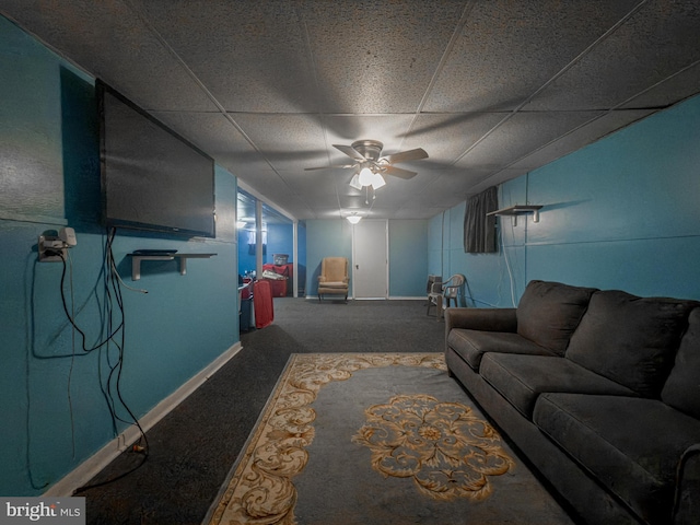 carpeted living room featuring a paneled ceiling