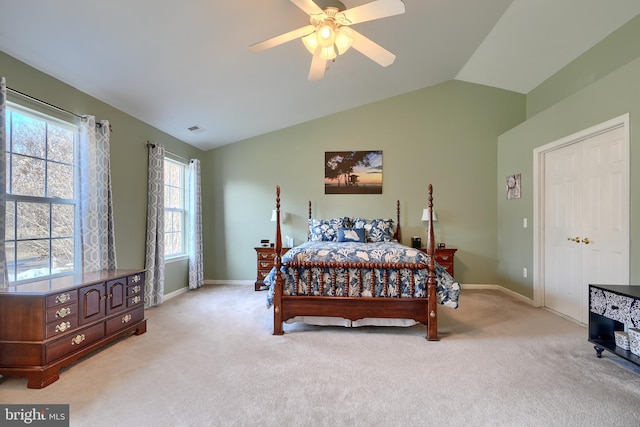 carpeted bedroom with lofted ceiling and ceiling fan