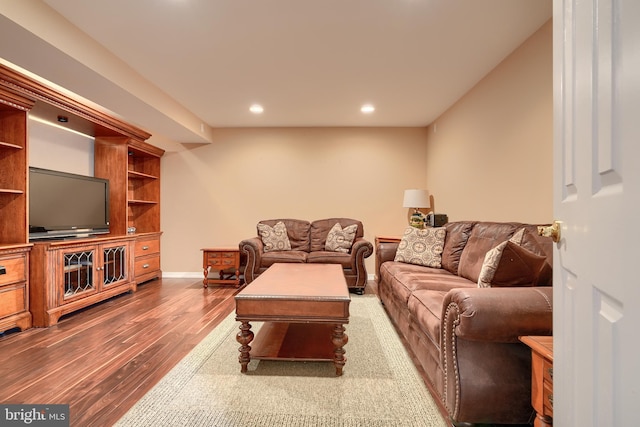 living room with dark hardwood / wood-style flooring