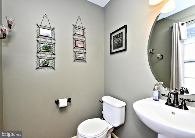 bathroom with sink and toilet