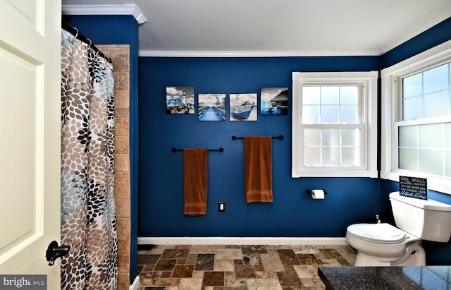 bathroom featuring crown molding, walk in shower, and toilet