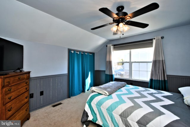 bedroom with vaulted ceiling, carpet, and ceiling fan