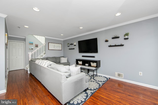 living room featuring dark wood-type flooring and crown molding