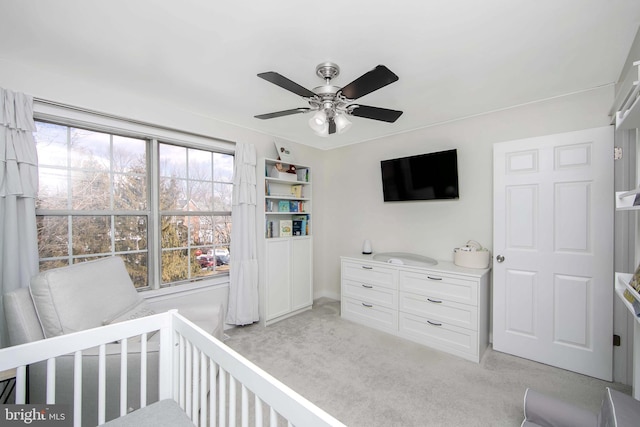 bedroom with ceiling fan and light colored carpet