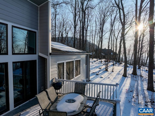 view of snow covered deck