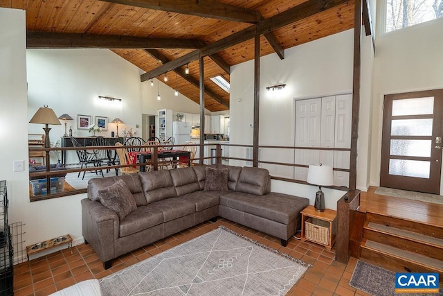 living room with beam ceiling, wood ceiling, high vaulted ceiling, and tile patterned floors