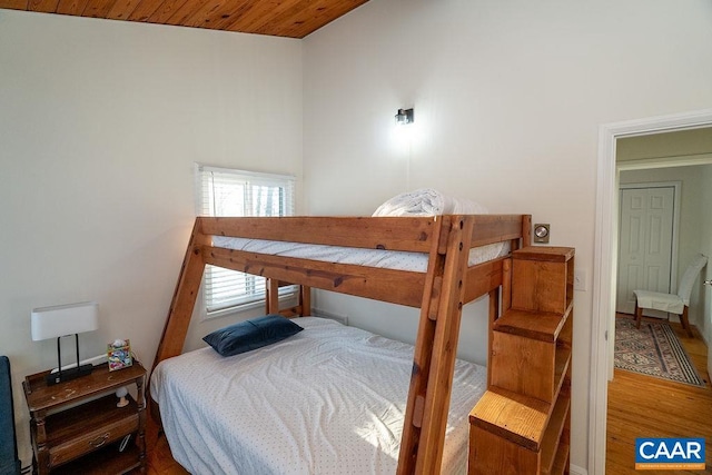 bedroom featuring wood ceiling and wood-type flooring