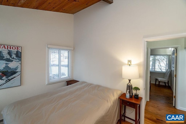 bedroom featuring hardwood / wood-style flooring, wooden ceiling, and high vaulted ceiling