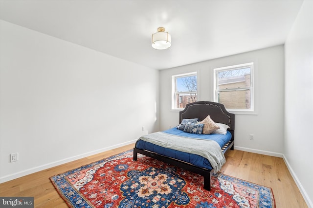 bedroom with hardwood / wood-style floors