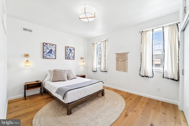 bedroom with light hardwood / wood-style floors