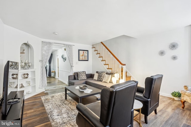 living room with dark hardwood / wood-style flooring