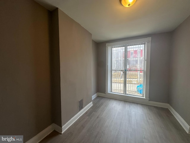 empty room featuring wood-type flooring