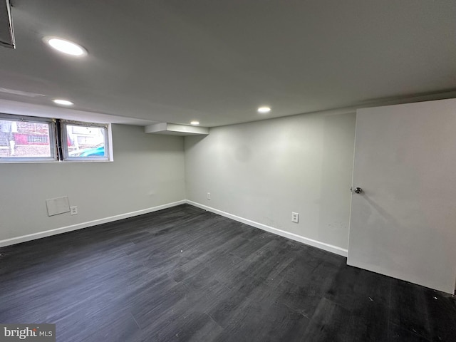 basement with dark wood-type flooring