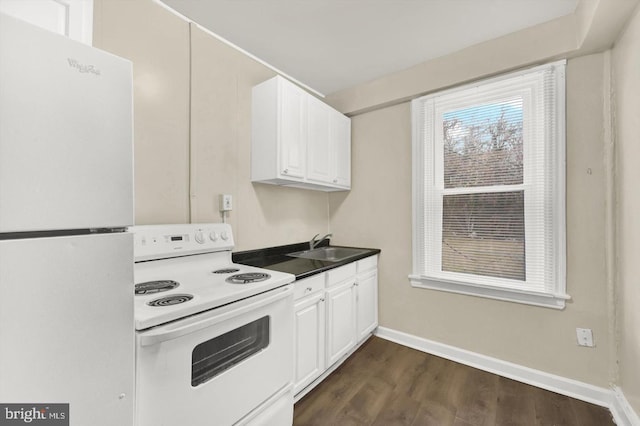 kitchen with white cabinetry, sink, white appliances, and dark wood-type flooring