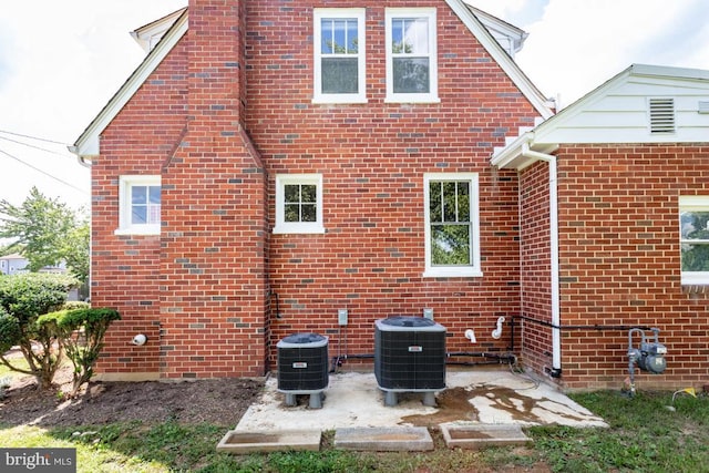 back of house featuring central AC and a patio