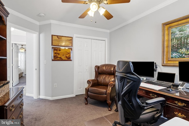 carpeted home office with ceiling fan, baseboards, and crown molding