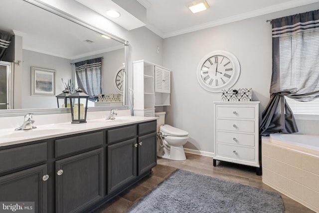 full bath featuring double vanity, ornamental molding, toilet, and a sink