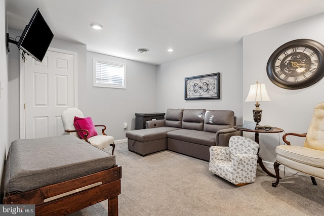 carpeted living area featuring recessed lighting, visible vents, and baseboards