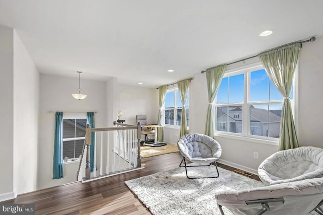 living area with hardwood / wood-style floors