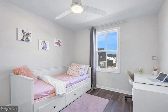 bedroom with ceiling fan and dark hardwood / wood-style flooring