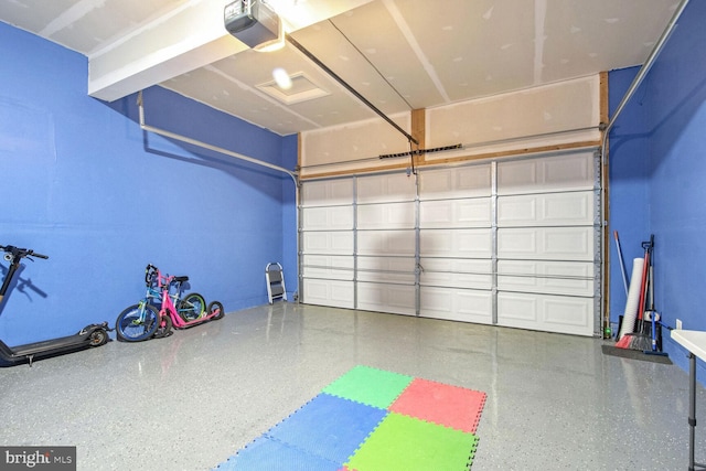 garage featuring a garage door opener