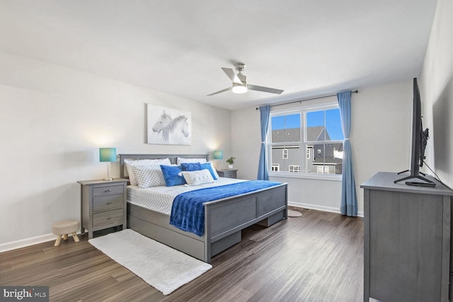 bedroom featuring dark hardwood / wood-style floors and ceiling fan