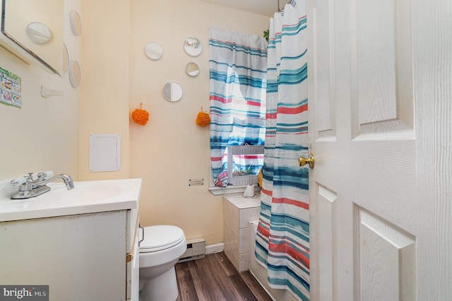 full bath with a baseboard heating unit, baseboards, toilet, wood finished floors, and vanity