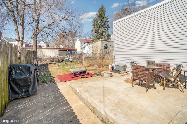 view of patio featuring grilling area and a fenced backyard