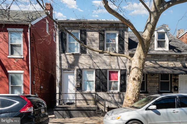 view of front of property featuring stone siding