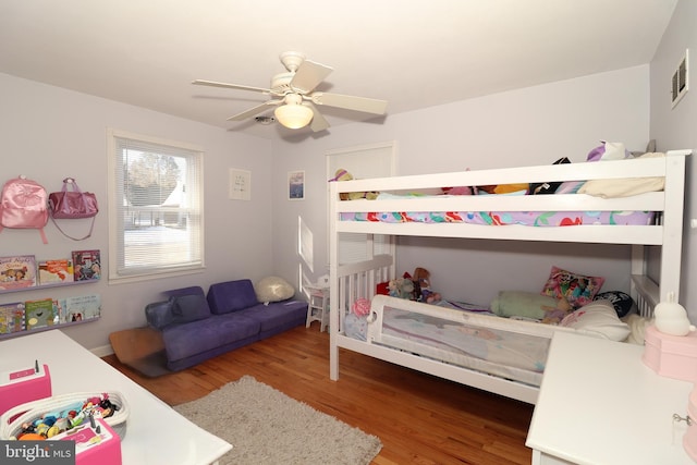 bedroom featuring ceiling fan and wood-type flooring