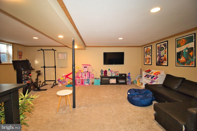 recreation room featuring ornamental molding and carpet floors