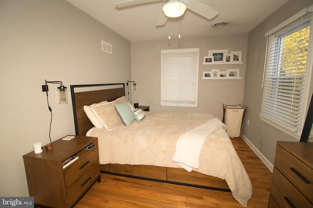 bedroom featuring light hardwood / wood-style floors and ceiling fan