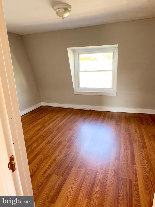 unfurnished room featuring hardwood / wood-style flooring