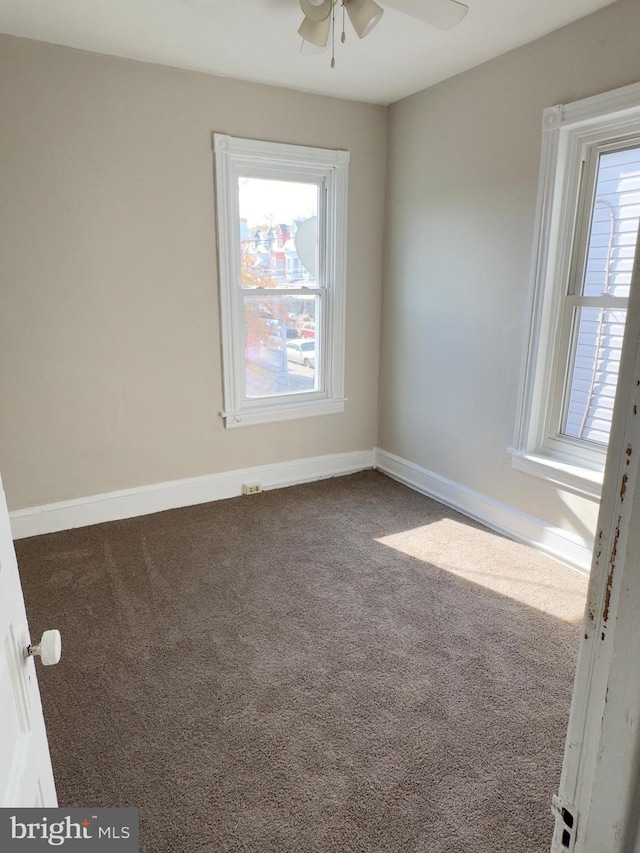 carpeted empty room with ceiling fan