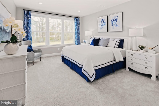 bedroom featuring light colored carpet