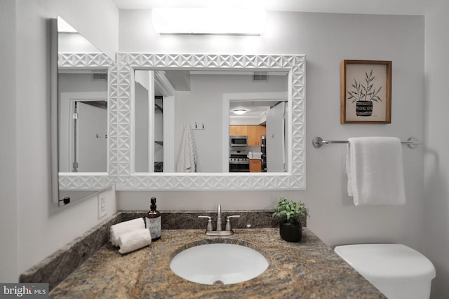 bathroom with vanity and a wall mounted AC