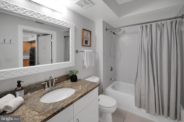 full bathroom featuring vanity, tile patterned floors, shower / bath combo with shower curtain, and toilet