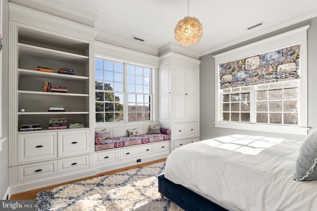 bedroom featuring hardwood / wood-style flooring and crown molding