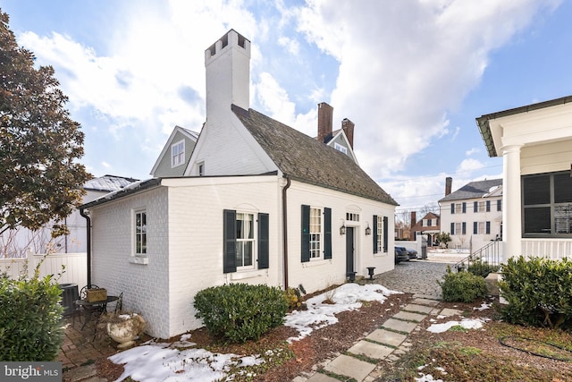 view of side of property featuring central AC unit