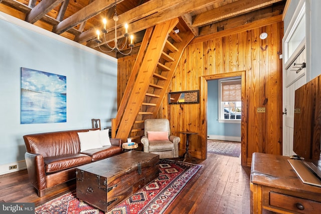 sitting room with wood ceiling, vaulted ceiling with beams, wooden walls, dark hardwood / wood-style floors, and a chandelier