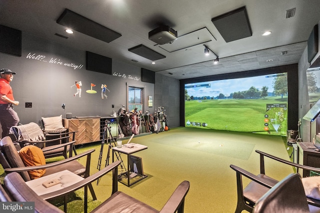 game room with golf simulator