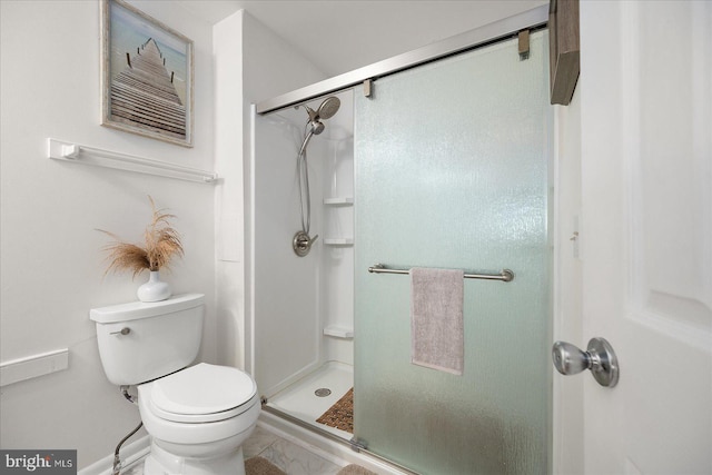 bathroom with toilet and walk in shower