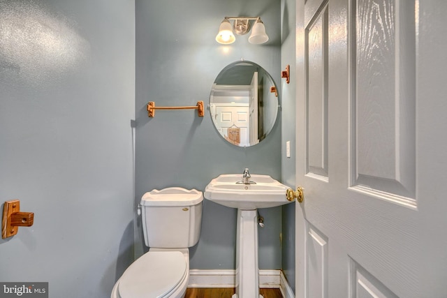 bathroom featuring sink and toilet