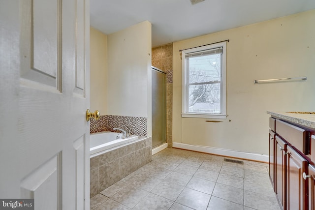 bathroom featuring vanity, tile patterned floors, and independent shower and bath