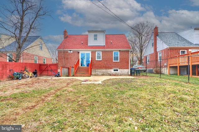 rear view of property with central AC and a lawn